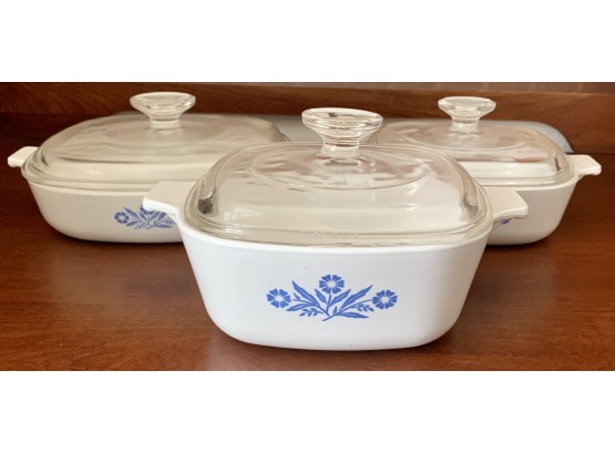 Three Corningware Dishes Of Various Sizes With Lids