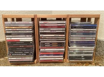 Lot Of Music CDs Which Include George Strait, Kenny Chensy, Briney Spears, Faith Hill, And More.