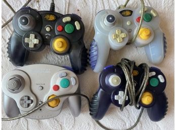 Set Of Four Console Controllers Including MadCatz & Nintendo Gamecube
