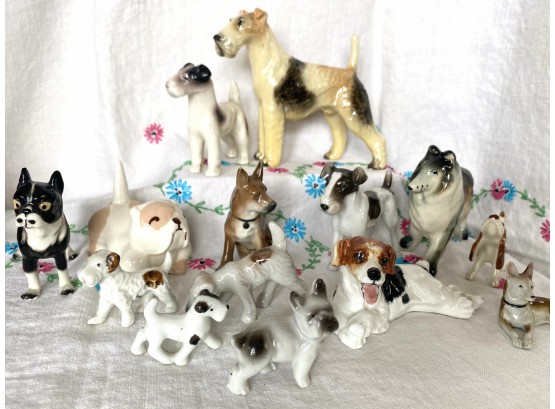 A Very Large Grouping Of Porcelain Dog Miniatures Including Royal Doulton