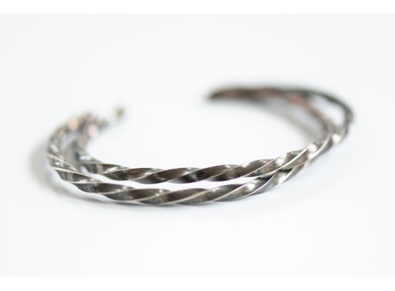 A Nice Group Of Two Sterling Silver Bangles With Twist Detail