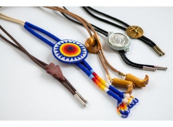 A Fabulous Grouping Of Vintage Bolos Including Beadwork, Arrowheads, And Kennedy Dollars