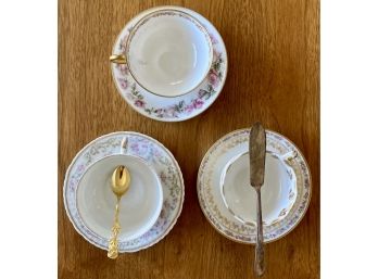 Three Teacups And Saucers (Mostly Haviland, Limoges), A WM Rogers Serving Knife, And Stainless Steel Spoon