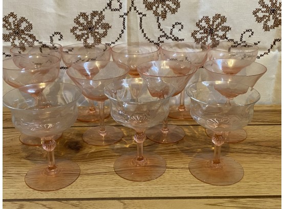 A Large Grouping Of Compatible Pink Glass Coupe Glasses In Three Patterns
