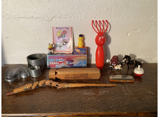 Vintage Slinkies, Wood Train Whistles And More Toys