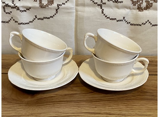 A Pair Of Two Crown Potteries Co Teacups And Saucers With Extra Teacups