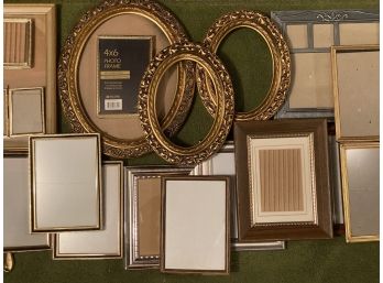A Grouping Of Vintage Picture Frames In A Variety Of Shapes And Sizes