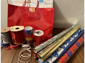 Grouping Of Wrapping Paper And Gift Bags With Ribbon