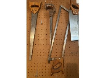 A Grouping Of Four Vintage Hand Saws