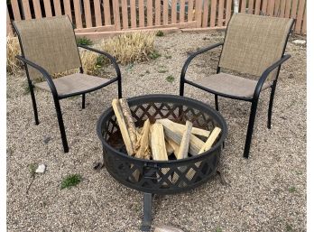 Fire Pit With Wood And Two Chairs