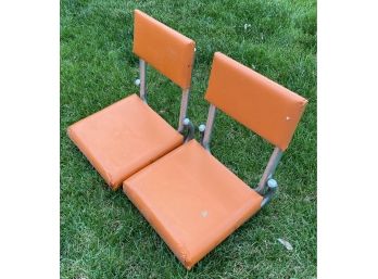 Two Small Ornage Stadium Chairs