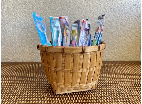 Small Basket And New In Packaging Toothbrushes