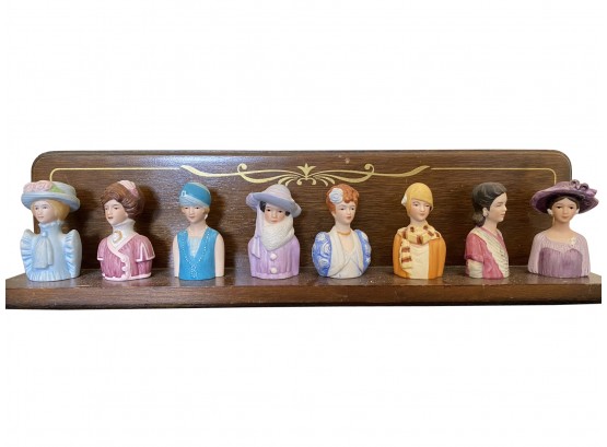 A Nice Group Of 8 Avon Porcelain Lady Thimbles On Stand From The 1980s
