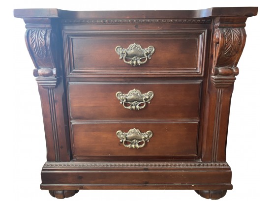 A Heavy Bedside Table With Three Drawers And Acanthus Leaf Design