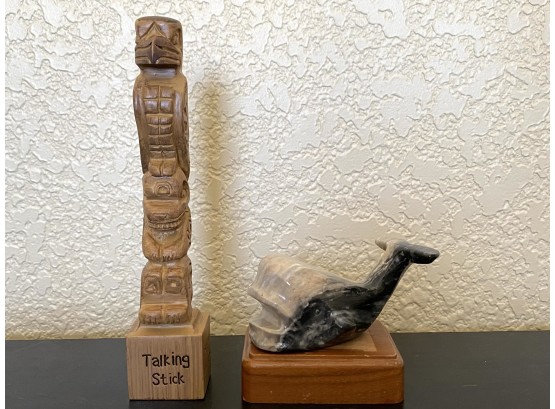 A Pair Of Two Decorative Objects Including Reproduction Talking Stick And Stone Whale On Pedestal