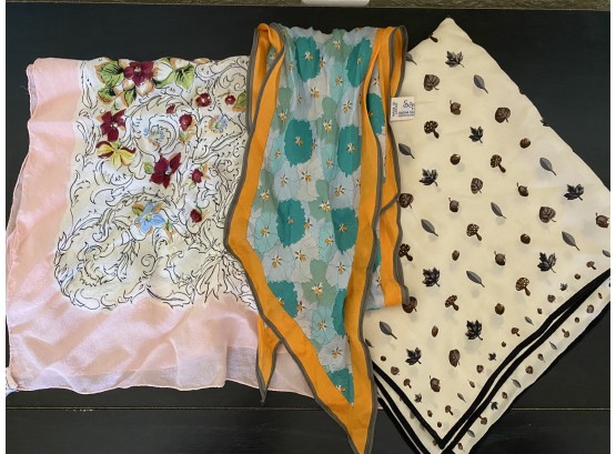 A Beautiful Grouping Of Silk Scarves Including Rectangular Floral, And Small Acorn And Mushroom Scarf