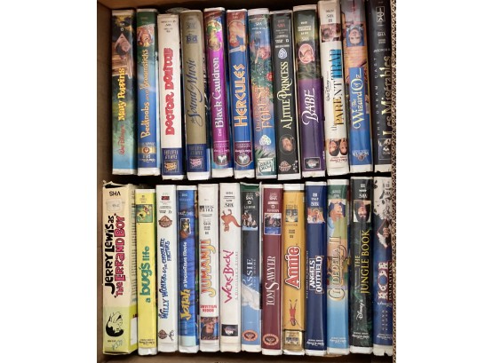 A Fun Grouping Of VHS Videos Including Disney, Cartoons, And Jerry Lewis