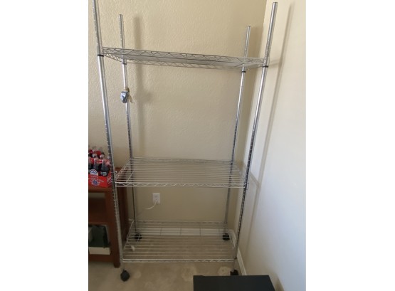 A Nice Metro Shelving Unit With Three Shelves And Wheels