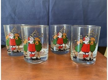 A Grouping Of Four Santa Glasses