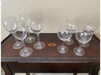 A Grouping Of 8 Wine Glasses Including 4 Tall And 4 Shorter