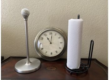 Two Paper Towel Dispensers And One Wall Clock