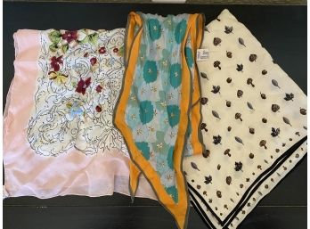 A Beautiful Grouping Of Silk Scarves Including Rectangular Floral, And Small Acorn And Mushroom Scarf