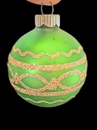 Vintage Shiny Bright Green Glass Ornament With Gold Glitter Design Made In USA