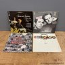 Four Vinyl Record Collection With Simon And Garfunkel, Chicago, And Ron Steele