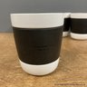 Set Of Four Starbucks Black And White Coffee Mugs With Silicone Grip Ring Around Center