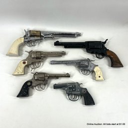 Six Toy Cap Guns
