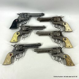 Six Texan Toy Cap Guns