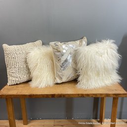 Four Beige Palette Wool. Cow Hide, And Faux Fur Decorative Throw Pillows