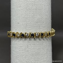 10K Gold Sapphire And White Topaz Tennis Bracelet
