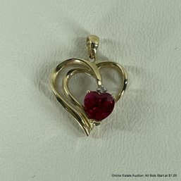 10K Yellow Gold Heart Shaped Pendant With Red Stone And Diamond Chip