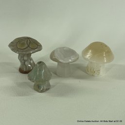 Four Assorted Stone And Ceramic Mushroom Figurines