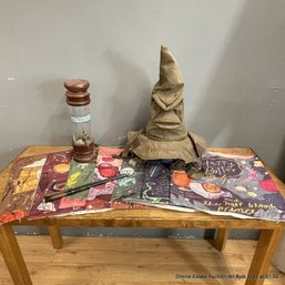 Assorted Harry Potter Decorative Items Including Pillow Cases, Sorting Hat, Wands, Butter Beer Dispenser