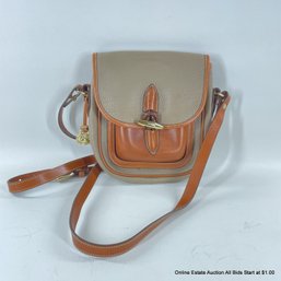 Vintage Dooney & Bourke Leather Crossbody Bag With Adjustable Strap And Toggle Closure