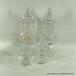 Four Assorted Apothecary Jars, One Filled With Dandelion Wishes