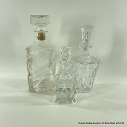 Three Glass Decanters Including I.W. Harper
