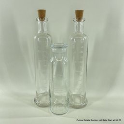 Three Stoppered Glass Bottles 'Genuine No. 13 Enchanted Elixir'