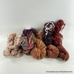 Assorted Skeins Of Yarn In Purple, Red And Pink Tones Including Crystal Palace And Colinette Yarns Ltd.