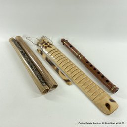 Four Assorted Hand-Carved Wooden Instruments