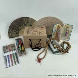 Assorted Asian Items Including Tea, Bookmarks, Fans, Chopsticks And More.