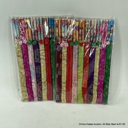 Two Packages Of Chopsticks In Fabric Sleeves