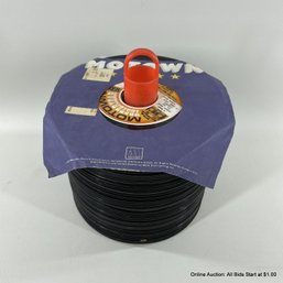 Large Collection Of 45 RPM Vinyl Records On Holder Stand