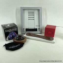 Cube Clock, Light Gathering Magnifier, Book Weight, And Book Mate