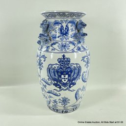 Blue And White Ceramic Vase With Floral Embellishments