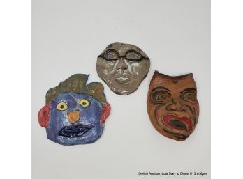 Three Pottery Face Plaques