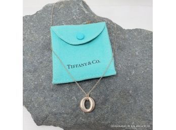 Elsa Peretti For Tiffany & Co. 'O' Pendant Necklace In Sterling Silver Having A Tiffany & Co. Chain.