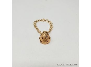 One (1) 14K Yellow Gold Bracelet Features A Beehive Charm With Bees And Accented With Rubies And Blue Sapphire